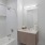 a bathroom with a tub sink and toilet
