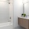 a bathroom with a tub sink and toilet