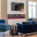 a living room with blue chairs