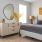 a bedroom with a bed and a mirror