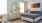 a bedroom with a bed and a mirror