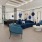 a room with blue couches and a wood floor