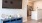 a room with a tv and cabinets