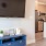 a room with a tv and cabinets