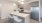 a kitchen with an island and chairs