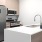 a kitchen with a stainless steel refrigerator