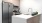 a kitchen with a stainless steel refrigerator