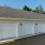 a white garage with a roof