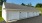 a white garage with a roof