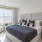 a bedroom with a bed and a desk