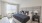 a bedroom with a bed and a desk