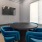 a room with blue chairs and a table